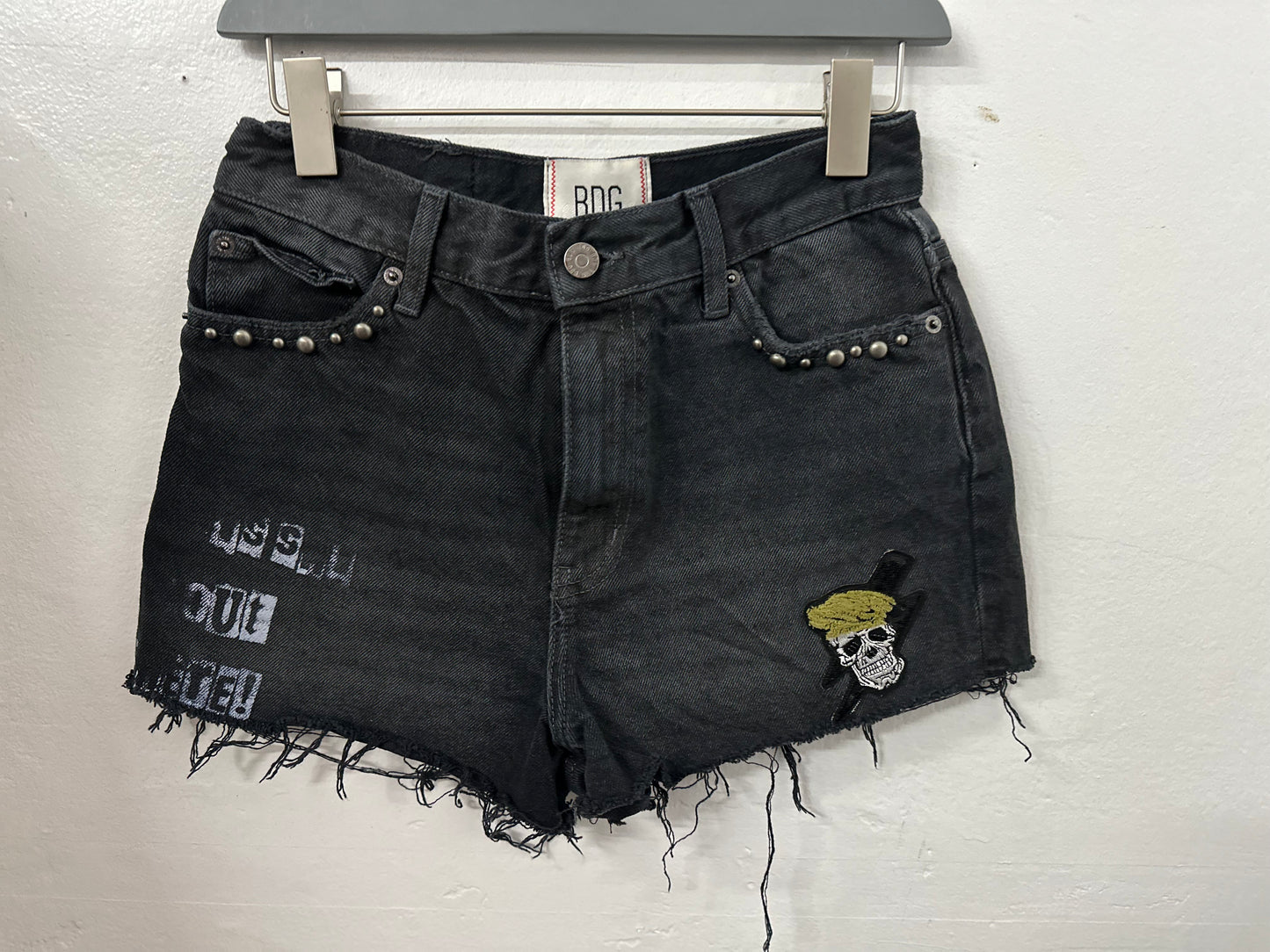 Denim short with patches screen print and nail heads 